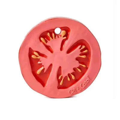 Chewable toy resembling a sliced tomato with detailed seeds and texture, branded by Oli & Carol.