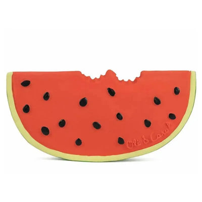 Chewable toy shaped like a watermelon slice, featuring a pink surface with black seeds and a yellow-green rind.