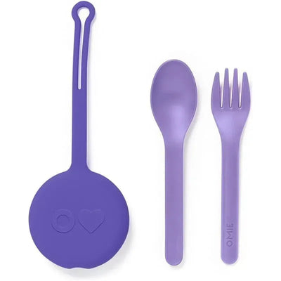 Reusable purple plastic fork and spoon set for kids, includes a matching pod for storage, featuring the Omie brand logo.