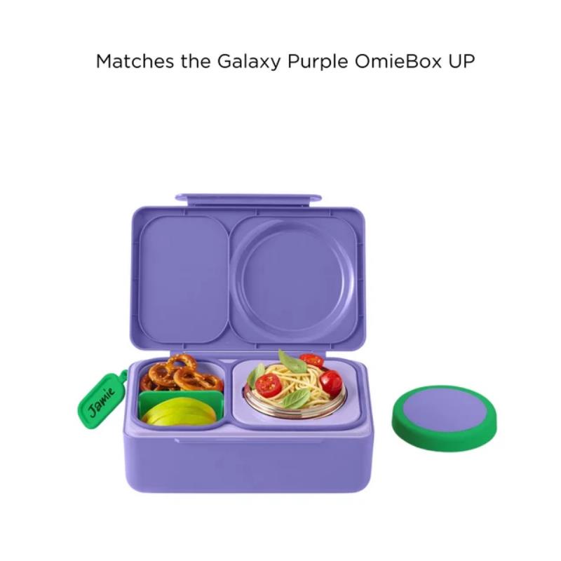 OmieBox Divider Up in green, featuring a purple lunchbox with compartments for food, including pasta and snacks.