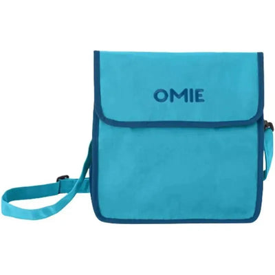 Insulated blue nylon lunch tote by Omie, featuring a flap closure and adjustable strap, ideal for transporting food.