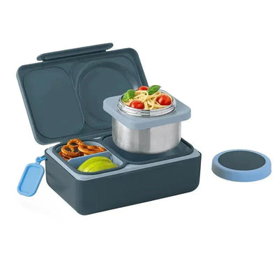 OmieBox Bento Box in graphite with compartments holding pasta, cherry tomatoes, pretzels, and apple slices.