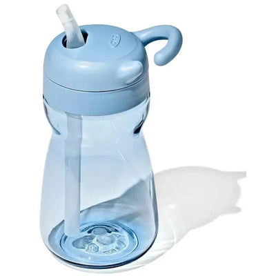 Oxo Tot Adventure Water Bottle in Dusk color, featuring a light blue body, straw, and a playful handle.
