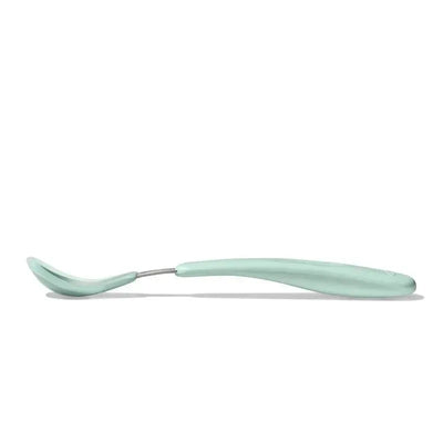 Soft silicone feeding spoon in Opal/Blossom color, designed for comfortable feeding of babies and toddlers.