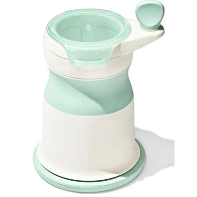 Baby food mill in opal color with a handle for easy mashing, designed for making homemade baby food.