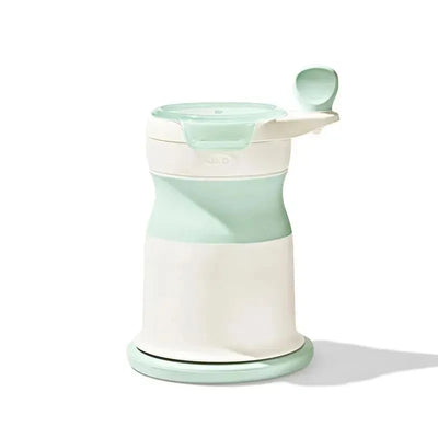OXO Tot Mash Maker Baby Food Mill in opal color with a top handle, designed for mashing and preparing baby food.