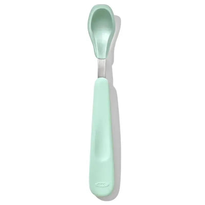 OXO Tot On-The-Go Feeding Spoon in opal color, featuring a soft, ergonomic handle and a rounded spoon bowl.