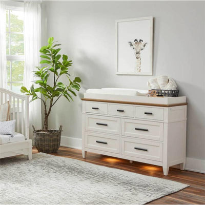 Parker House Artisan Changing Tray with a wooden top, storage drawers, and a changing pad in a stylish nursery setting.
