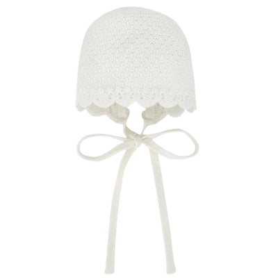 Baby knit newborn bonnet in cream with scalloped edge and tie straps for secure fit.