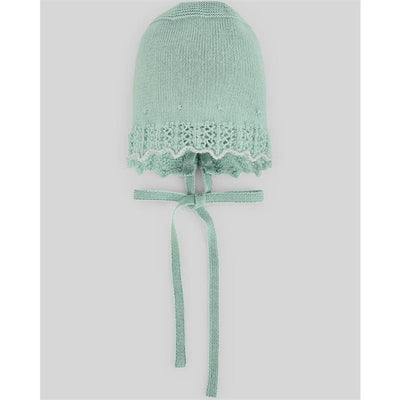 Knitted mint green bonnet with lace trim and ties at the neck, designed for infants.
