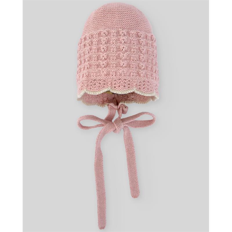 Knit newborn bonnet in powder pink and light brown with a scalloped edge and ties for securing.