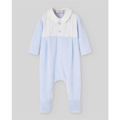 Newborn romper in chalk blue color featuring a white collar and button detail, designed for comfort and style.