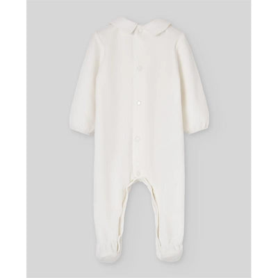 Knit newborn romper in cream, featuring long sleeves, a collar, and snap button closure.