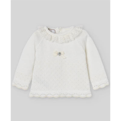 Chalk pink and cream long-sleeve sweater with ruffled collar and decorative bow detail.