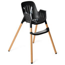 High chair in black with gold legs, featuring a safety harness and a sleek, modern design.