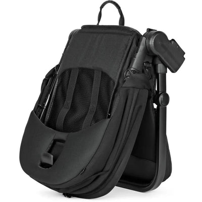 Peg Companion Seat in True Black, featuring a padded seat with mesh back, adjustable straps, and a foldable design.