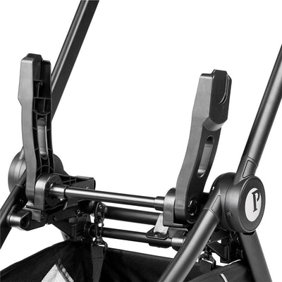 Foldable car seat adapter by Peg Perego featuring adjustable arms and black metallic finish, designed for the City Loop stroller.
