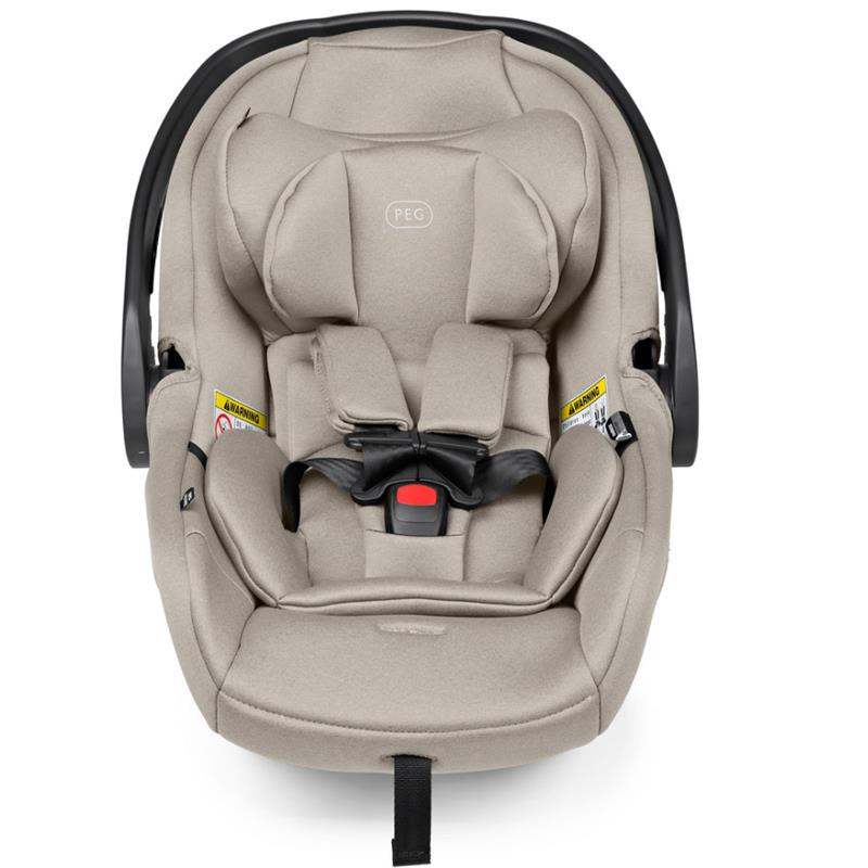 Peg Primo Viaggio Nido Infant Car Seat in Astral color, featuring soft fabric, harness system, and safety warning labels.
