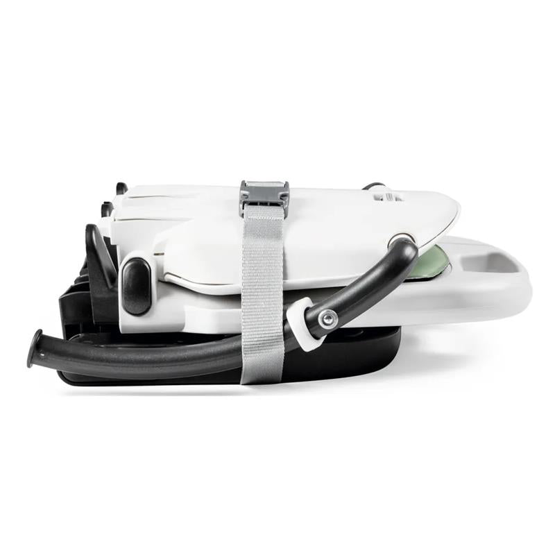 Peg Rialto Booster High Chair in Licorice, featuring a compact folded design with a safety strap and tray.