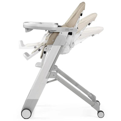 Peg Siesta High Chair in Astral Beige, featuring a reclining seat, tray, and wheels for mobility.