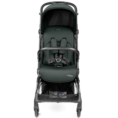 Compact Peg Perego Volo stroller in sage green, featuring a cushioned seat, safety harness, and storage basket below.