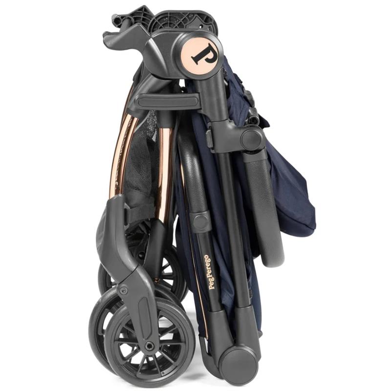 Compact Peg Perego Volo stroller in Blue Shine, featuring a sleek foldable design and lightweight frame with black wheels.