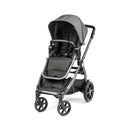 Peg Perego Ypsi Travel System in metal, featuring a sleek black stroller design, adjustable canopy, and safety harness.