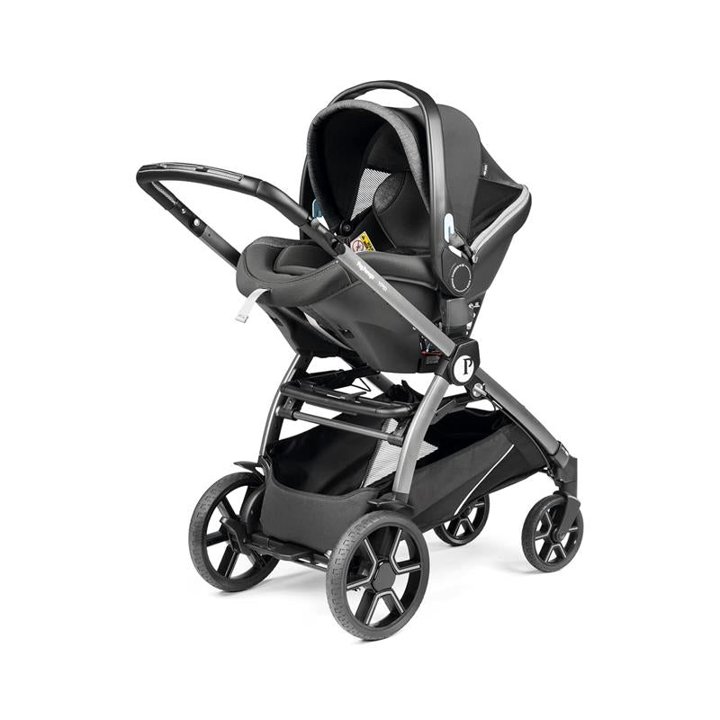 Peg Perego Ypsi Travel System in metal, featuring a stroller with a car seat attached, designed for infant transport.