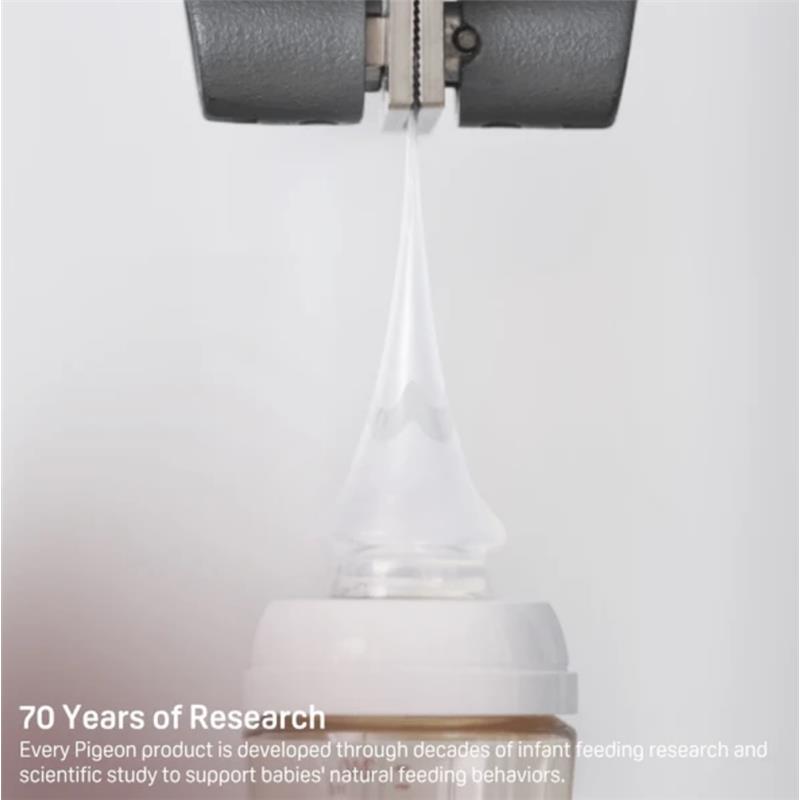 Silicone nipple from Pigeon for infants 3+ months, demonstrating its flexibility with a droplet forming at the tip.
