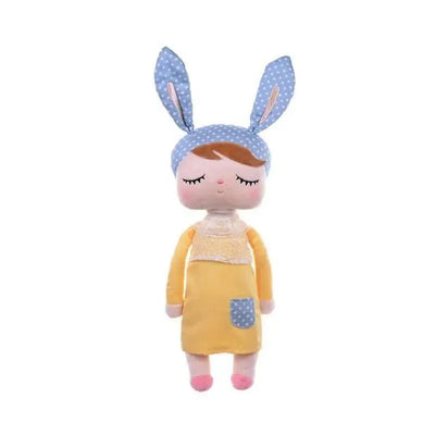 Plush doll named Metoo Angela, featuring a girl in a yellow dress, blue polka dot headband, and cute facial details.