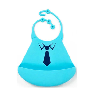 Silicone baby bib in blue featuring a tie design, designed to catch spills during mealtime.