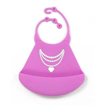 Silicone baby bib in pink with a decorative design of white beads and a heart, featuring a catch-all pocket.
