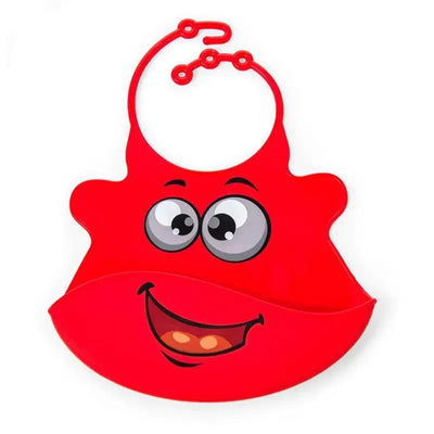 Silicone baby bib in bright red featuring a smiling face design and a pocket for catching food spills.