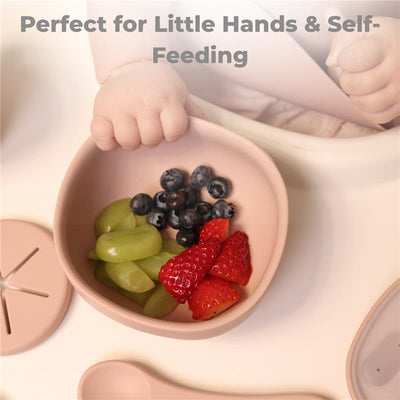 Silicone suction bowl in dusty blue with mixed fruits, designed for toddlers and self-feeding.
