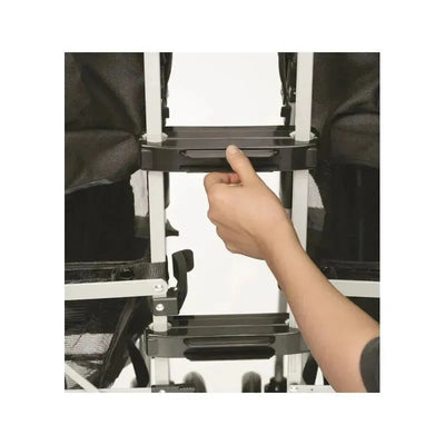 Stroller connectors from Prince Lionheart with a hand adjusting the attachment between two strollers.