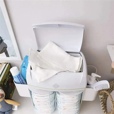 Prince Lionheart Warmies Wipes Warmer with warm wipes visible, accompanied by lotion and a comb on a white surface.