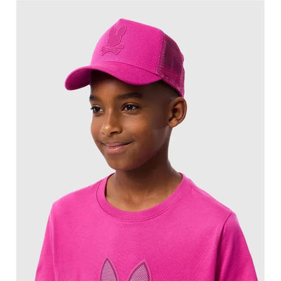 Fuschia red Psycho Bunny Riviera Trucker Cap worn by a smiling child, featuring a bunny logo embossed on the front.