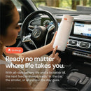 Portable Quark BuubiBottle milk warmer held by a person in a car, featuring a sleek design, emphasizing convenience and battery life.