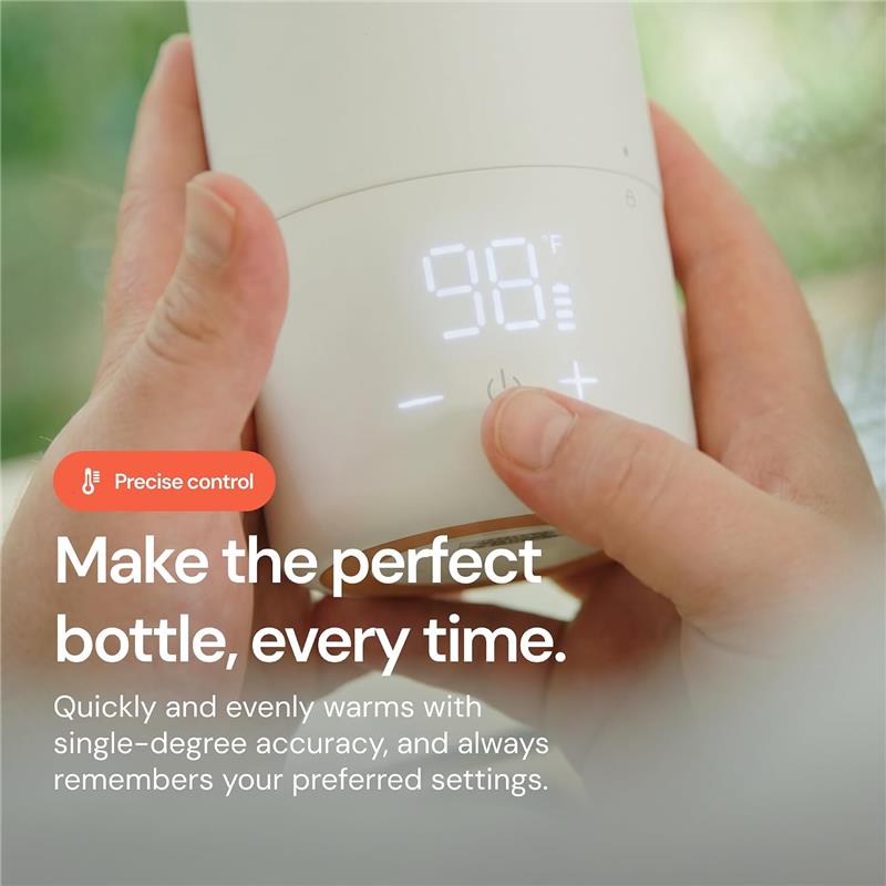 Quark BuubiBottle Portable Milk Warmer PRO being operated, displaying 98°F setting and control buttons for precise warming.