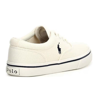 Vulcanized baby sneakers in cream canvas with navy accents and a logo, designed for boys by Ralph Lauren.