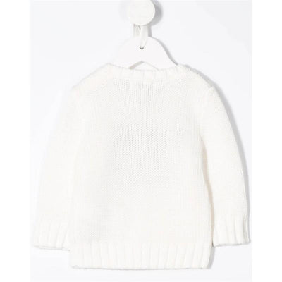 Crewneck sweater for babies in white cotton, featuring ribbed cuffs and hem, displayed hanging.