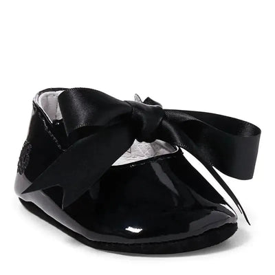 Black patent leather slipper for kids by Ralph Lauren, featuring a large satin bow detail on the front.