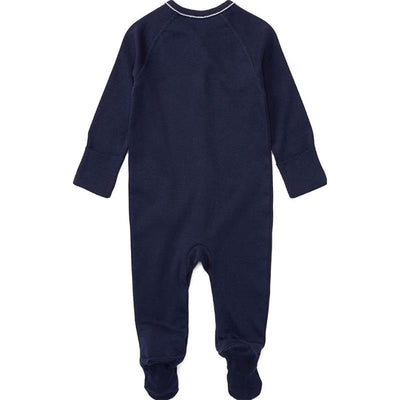 Solid French navy coverall for newborn boy with long sleeves and footed bottom.