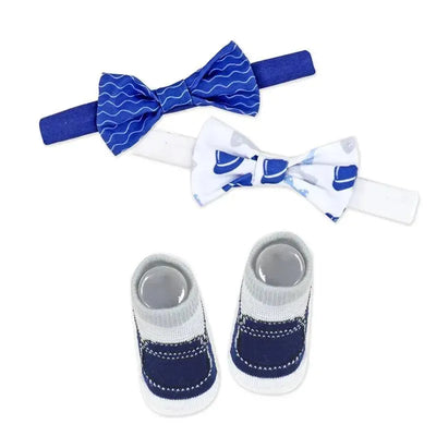 Navy and white 3-piece socks and bowtie set featuring two bowties and a pair of socks decorated with navy accents.