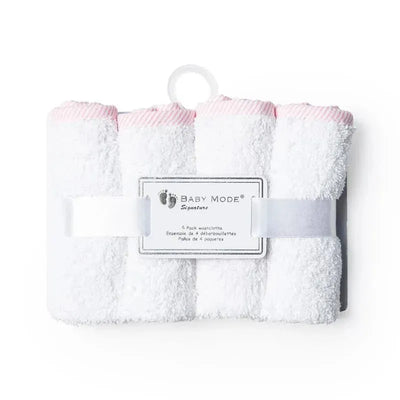 Solid pink-trimmed washcloths in a pack of six, featuring soft white fabric and a labeled holder.
