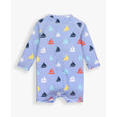 Long sleeve baby boys swimsuit featuring a light blue pattern of colorful sailboats.