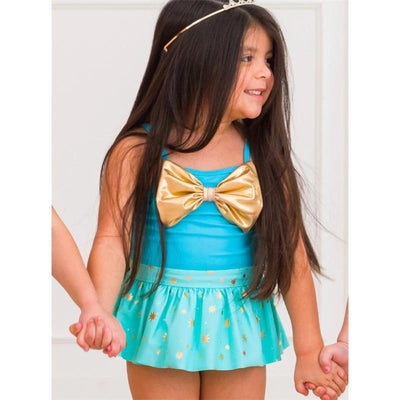Teal and gold princess big bow skirted one-piece swimsuit on a smiling girl with long hair, holding hands with friends.