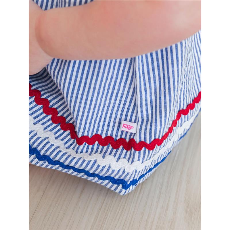 Blue and white striped seersucker fabric with red and white ric rac trim, featuring a small Rufflebutts label.