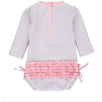 Lavender seersucker long sleeve one-piece rash guard for baby girls, featuring pink ruffle trim and back zipper closure.