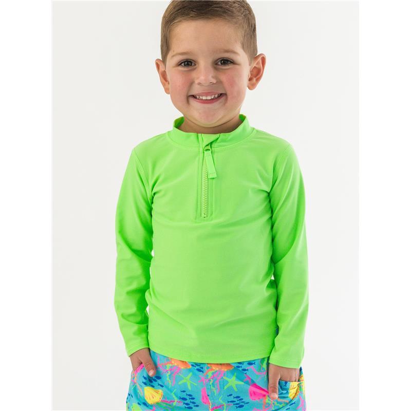 Boys long sleeve zipper rash guard in neon honeydew color, worn by a smiling child, paired with colorful swim shorts.